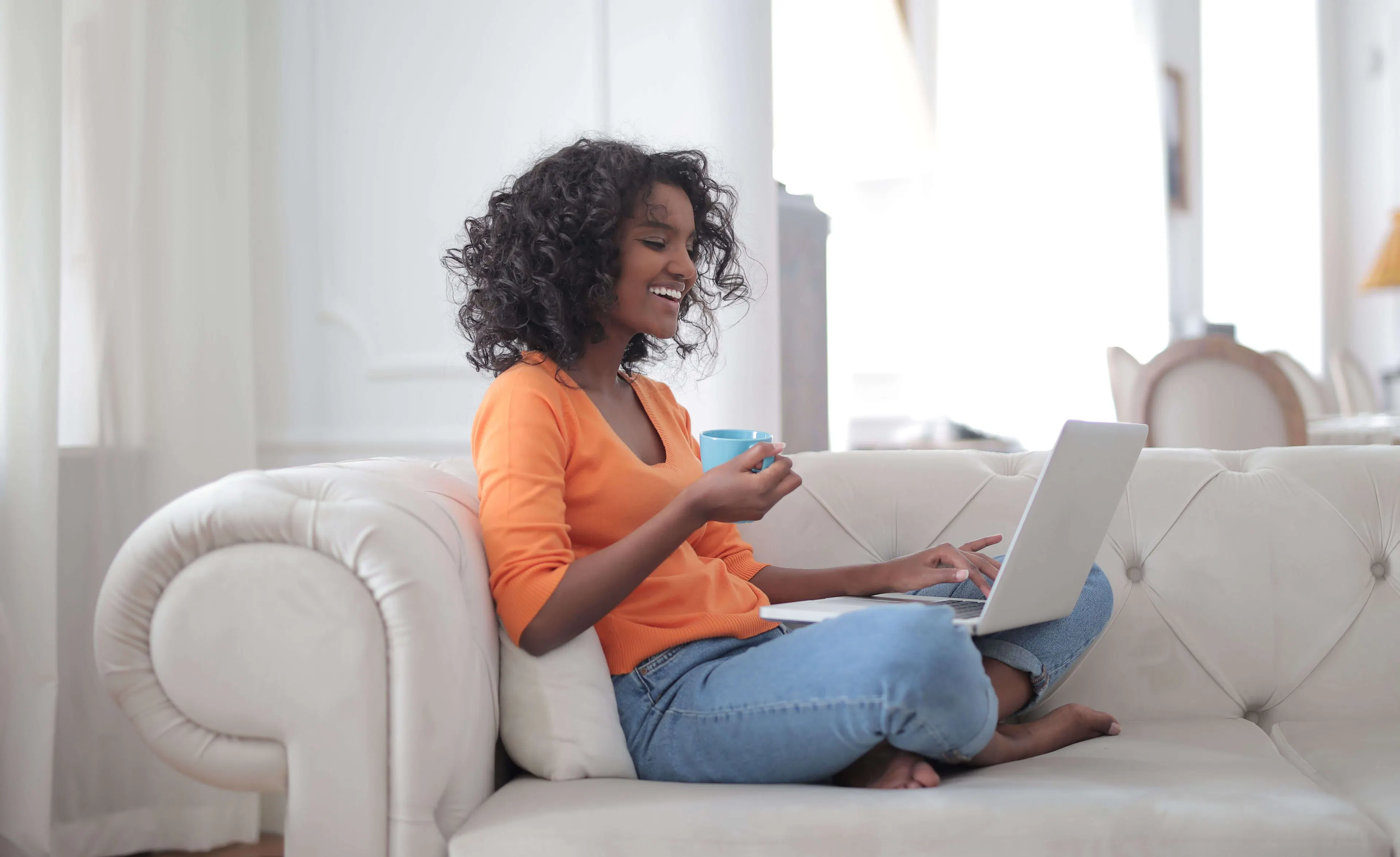 relaxed and happy person working on laptop