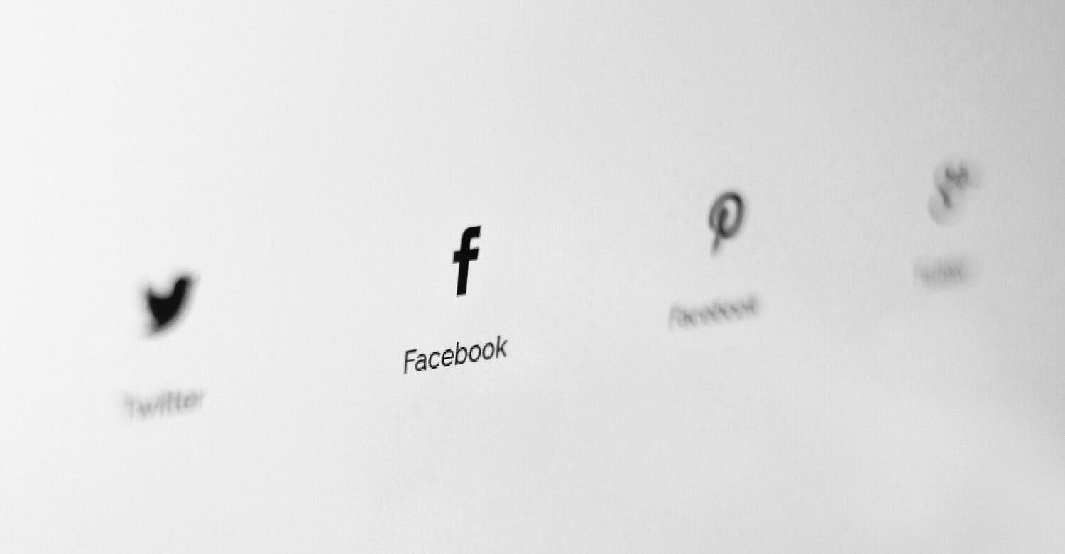a close up of a computer screen with social media icons