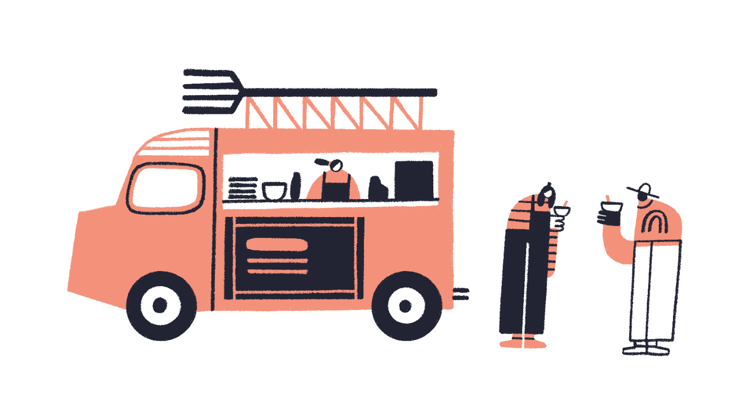 a person standing next to a food truck