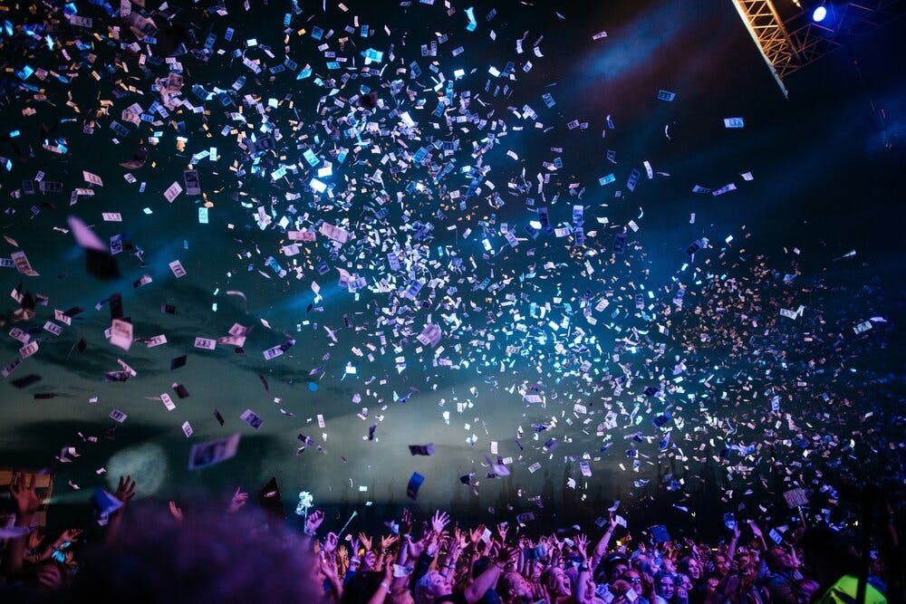 confetti flying in the air at a concert