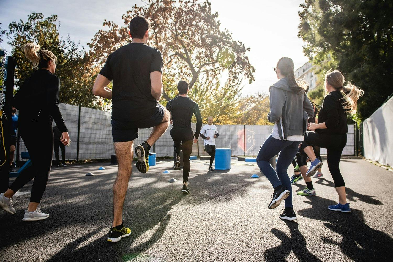 a group of people in gym class on a street