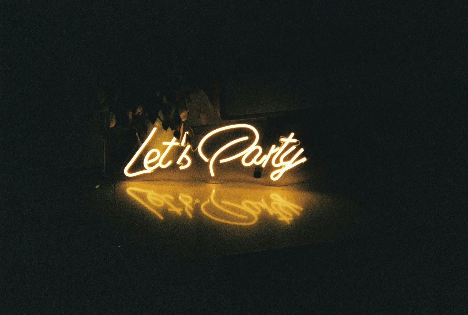 a lit up sign in the dark