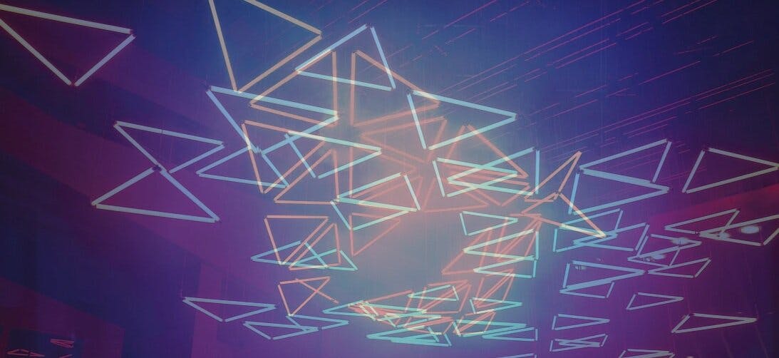 a group of triangles in a blue background