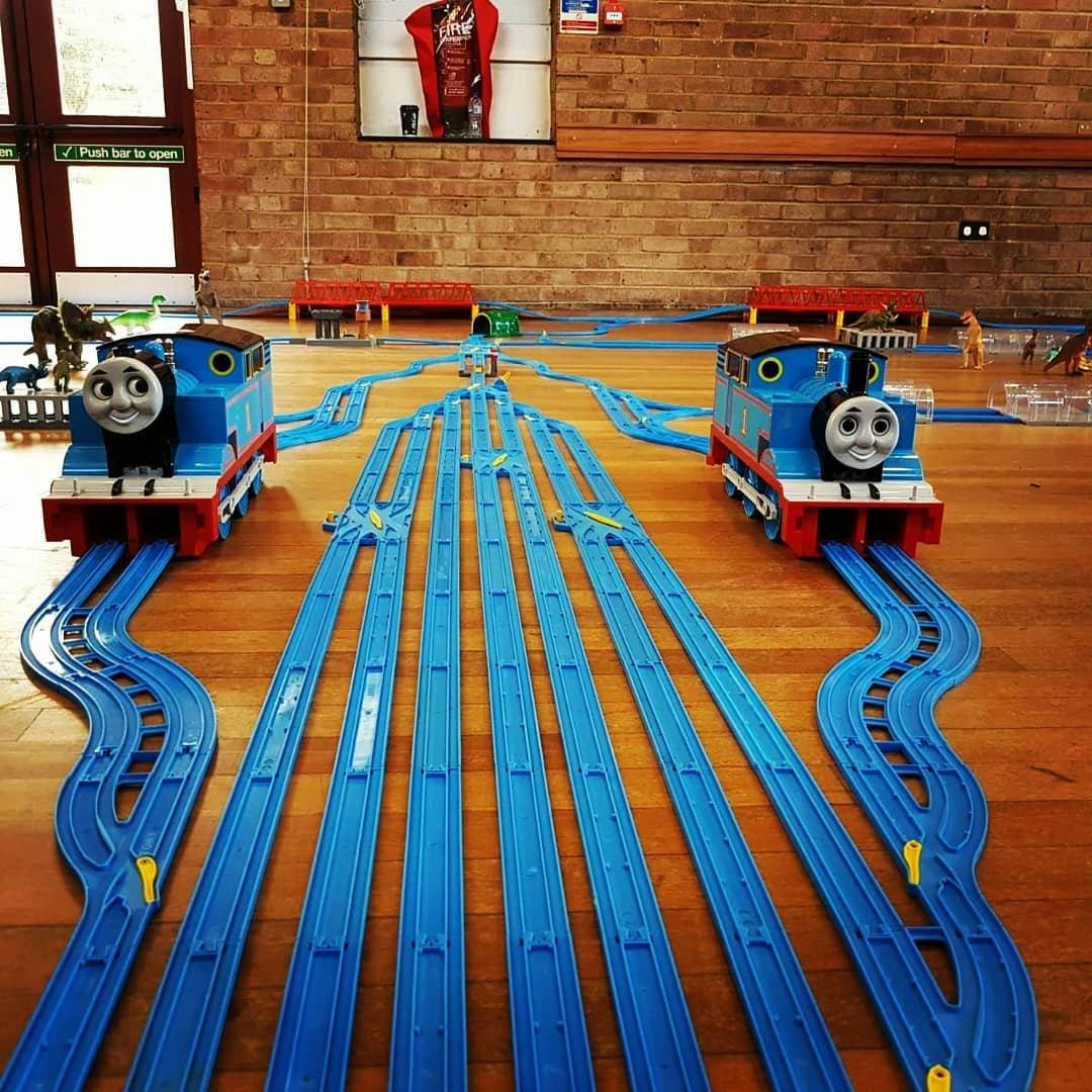 a toy train on a wood floor