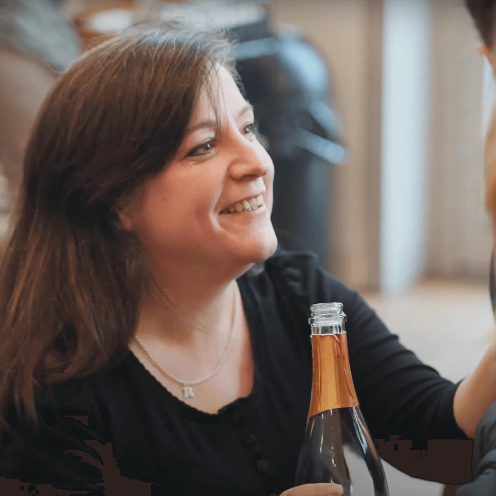 Becky smiling while talking to customers