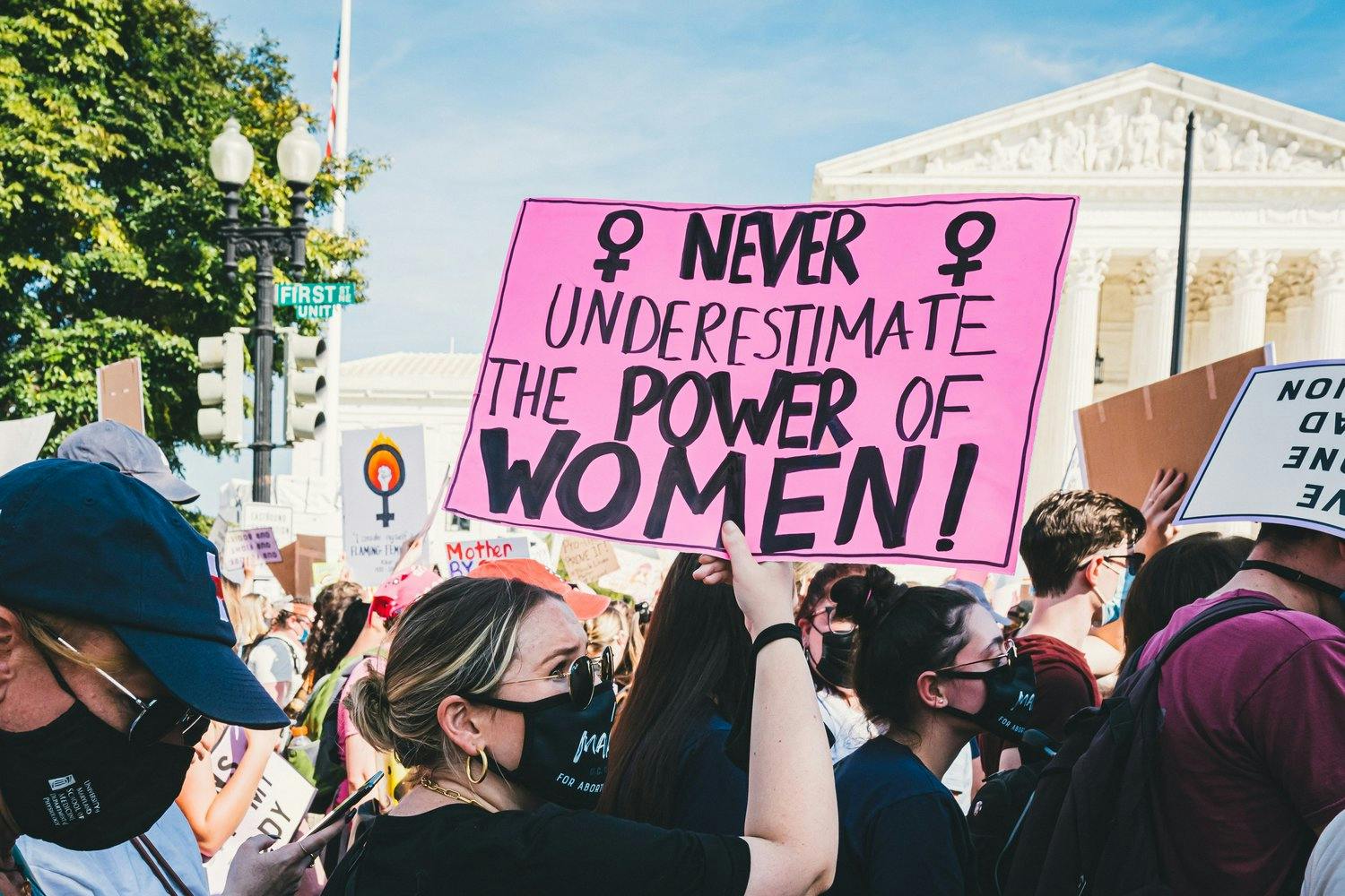 a group of people holding a sign