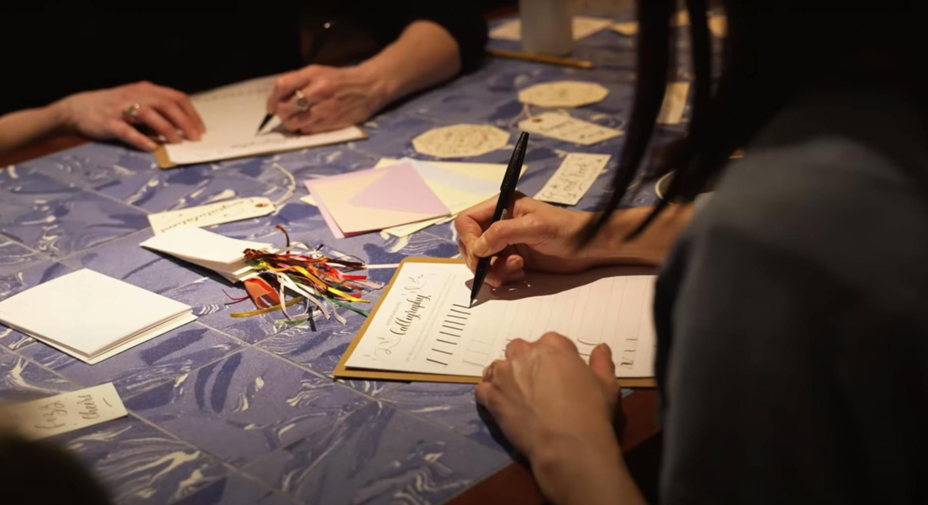 calligraphy two hands writing