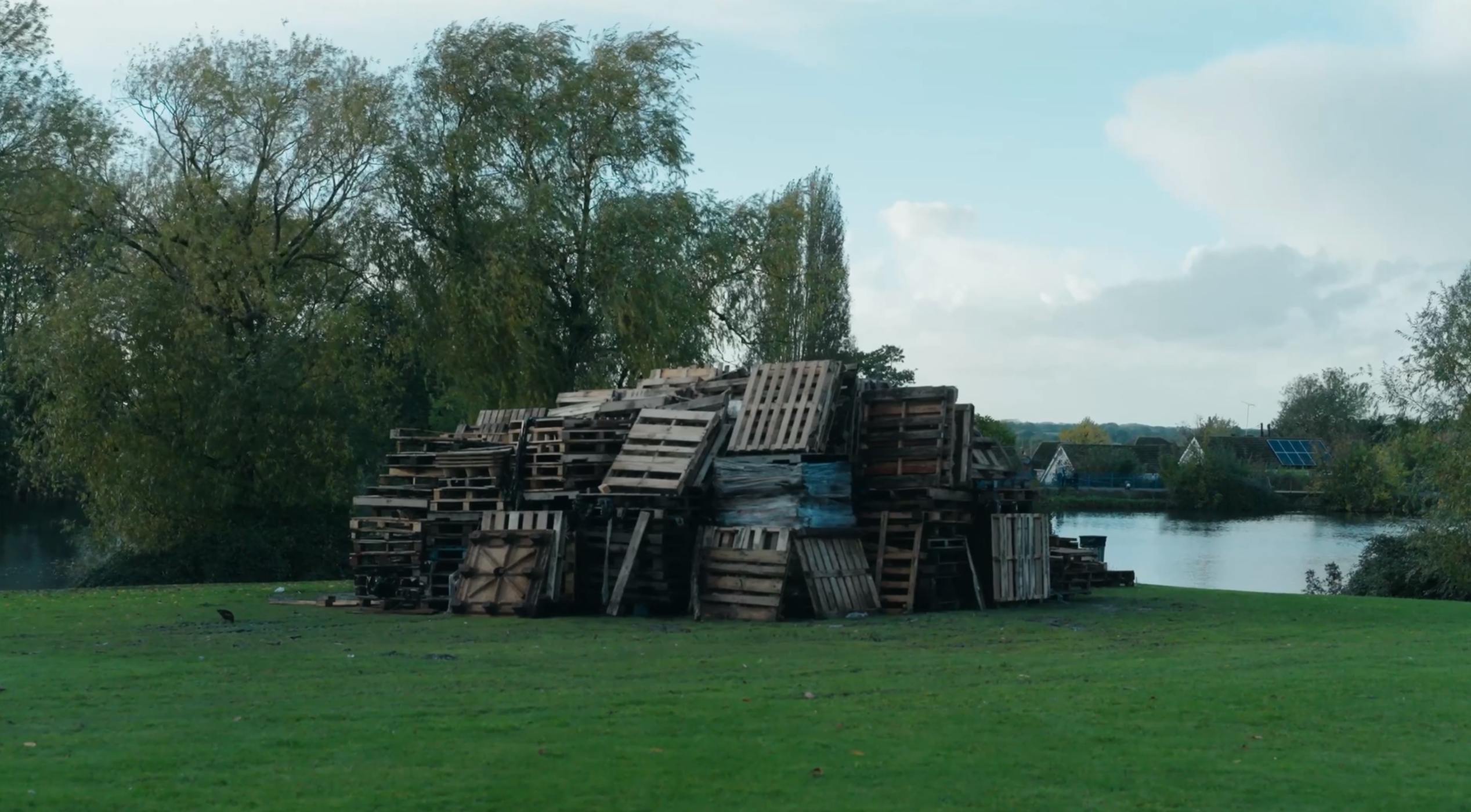 Bonfire wooden crates in daytime ready to be lit in the evening