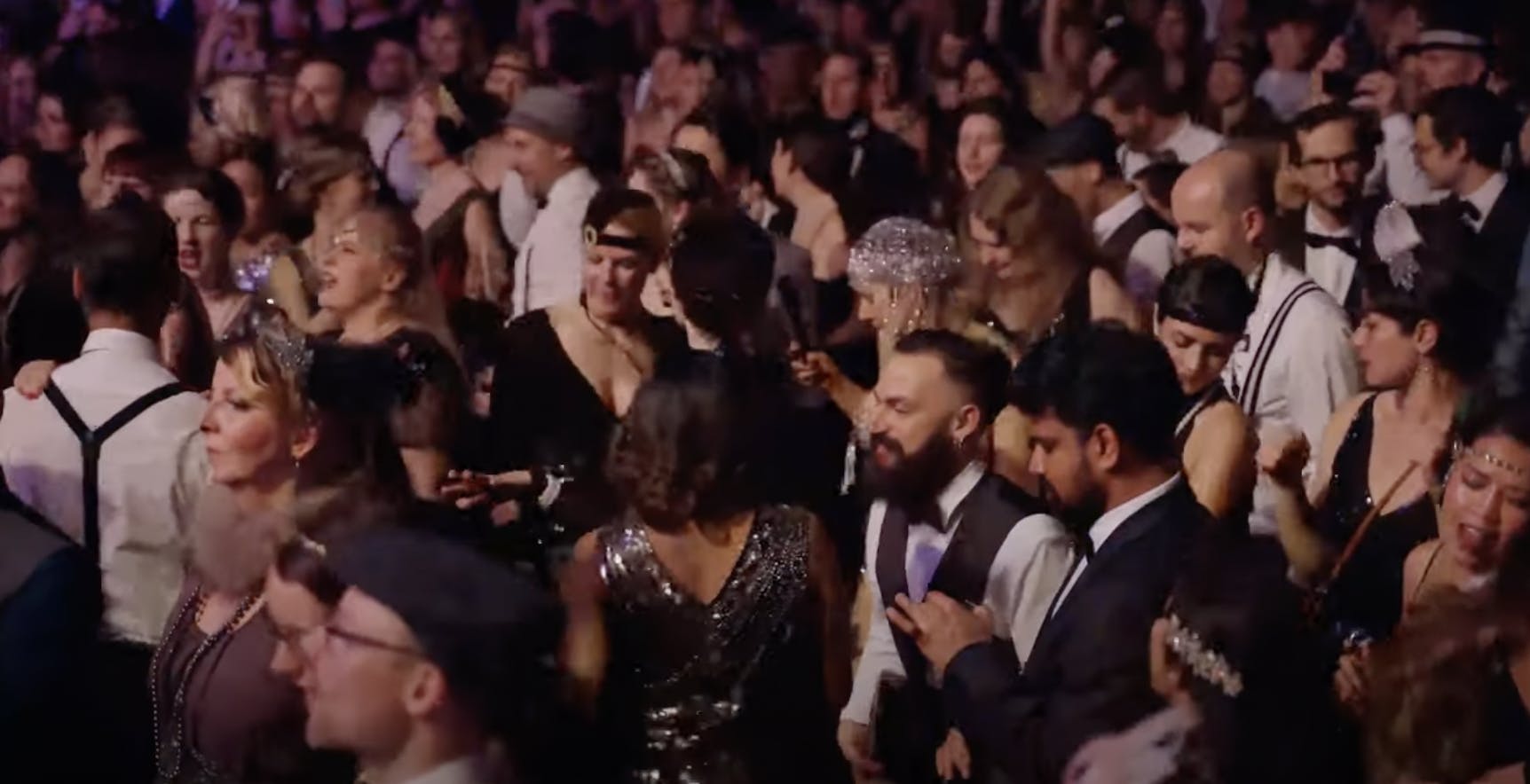 crowd dancing in 1920s clothin