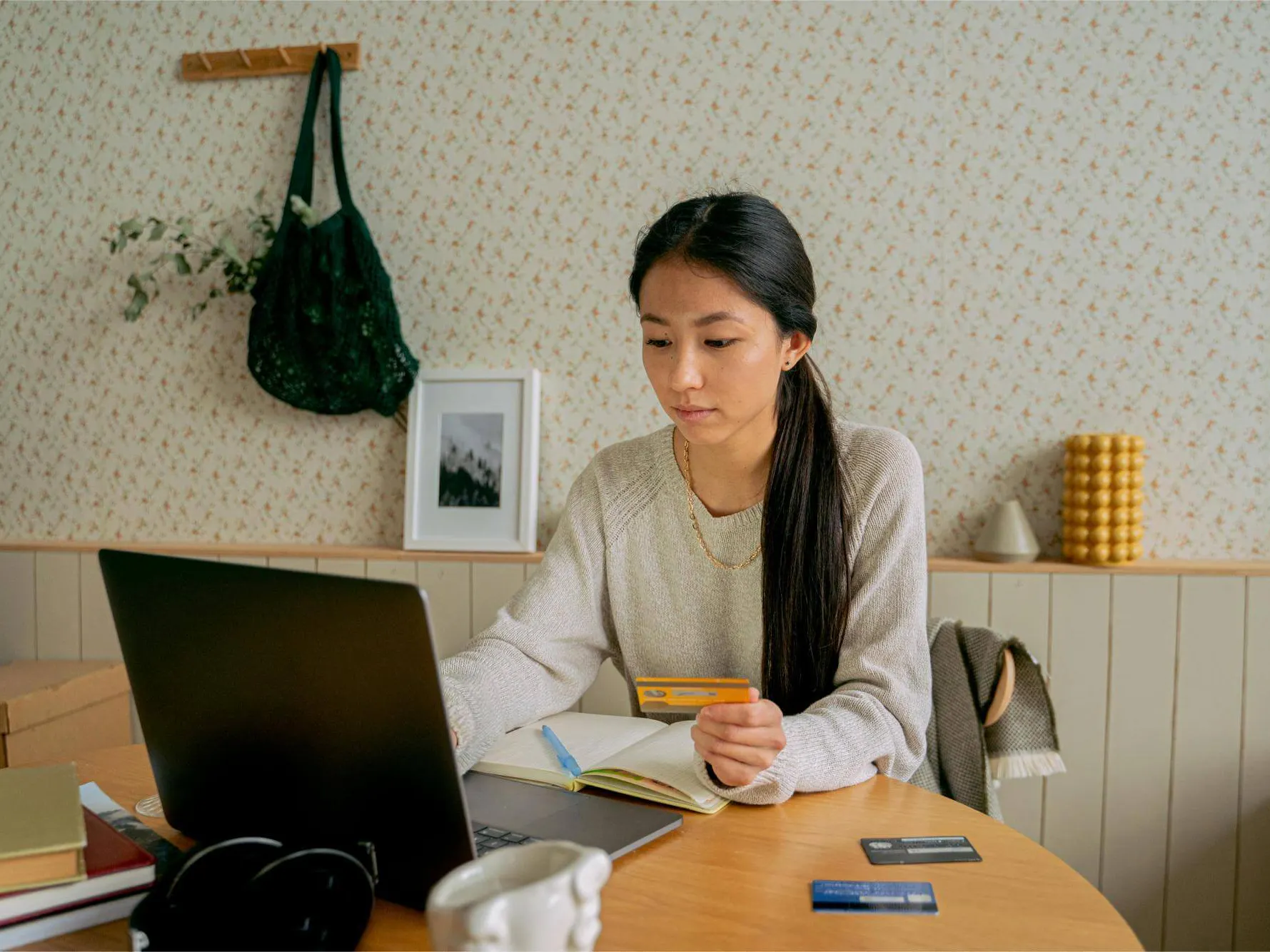 Woman making payment on laptop at table