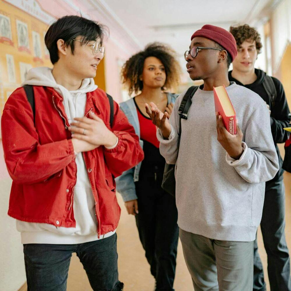 Students walking through school hallway