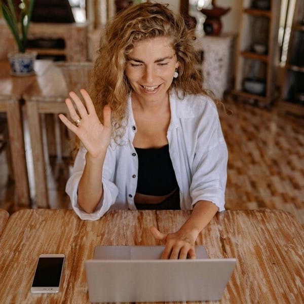 Woman speaking to people online