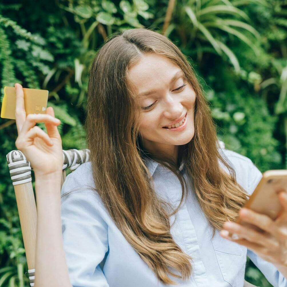 woman making payment on phone