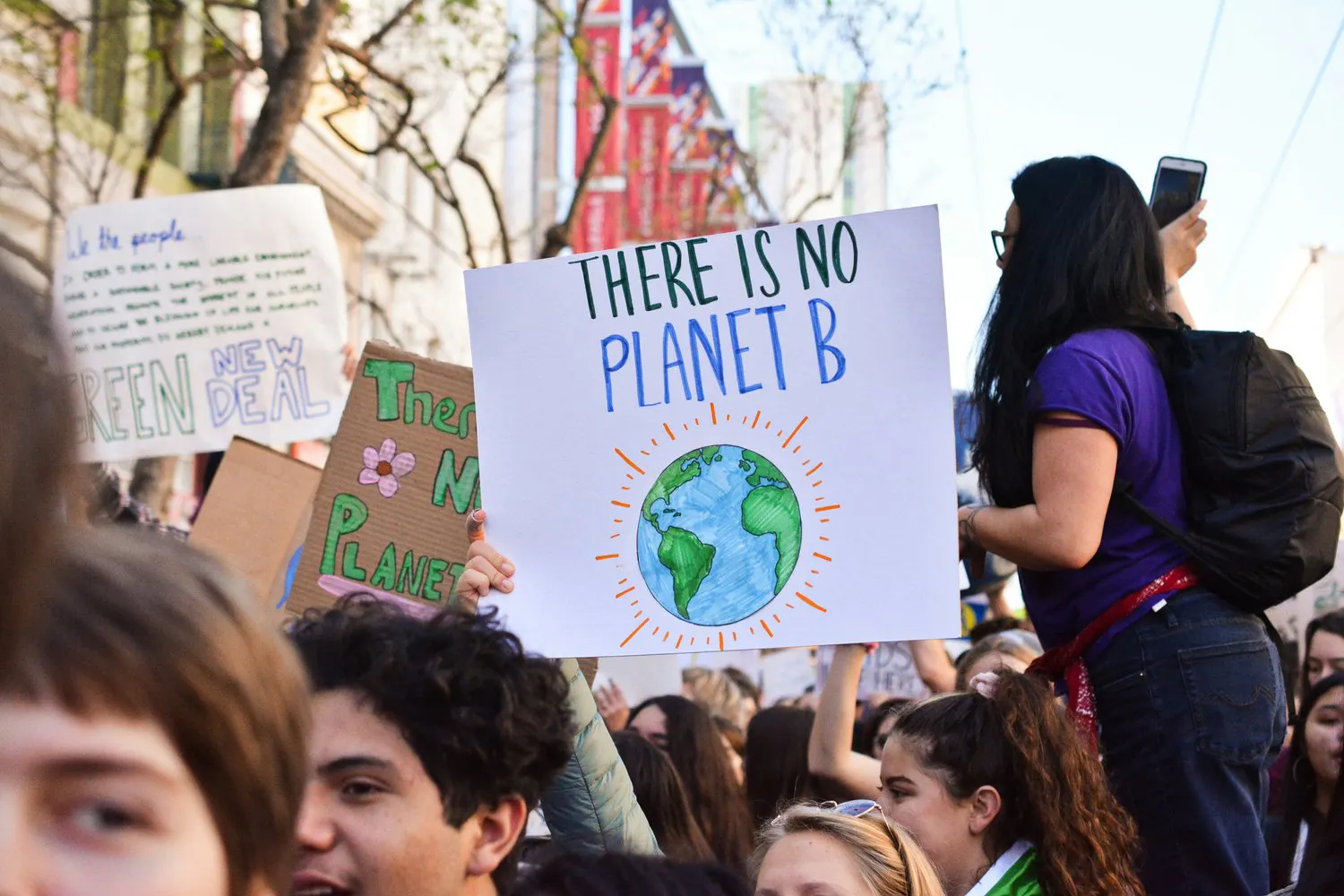 Environmental protest with 'There is no planet B' sign