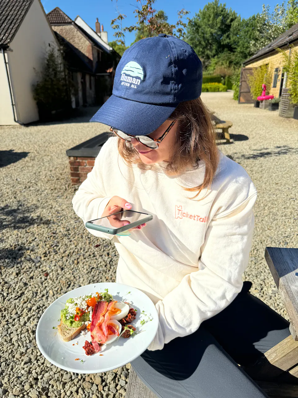 claire taking photo of breakfast on her phone