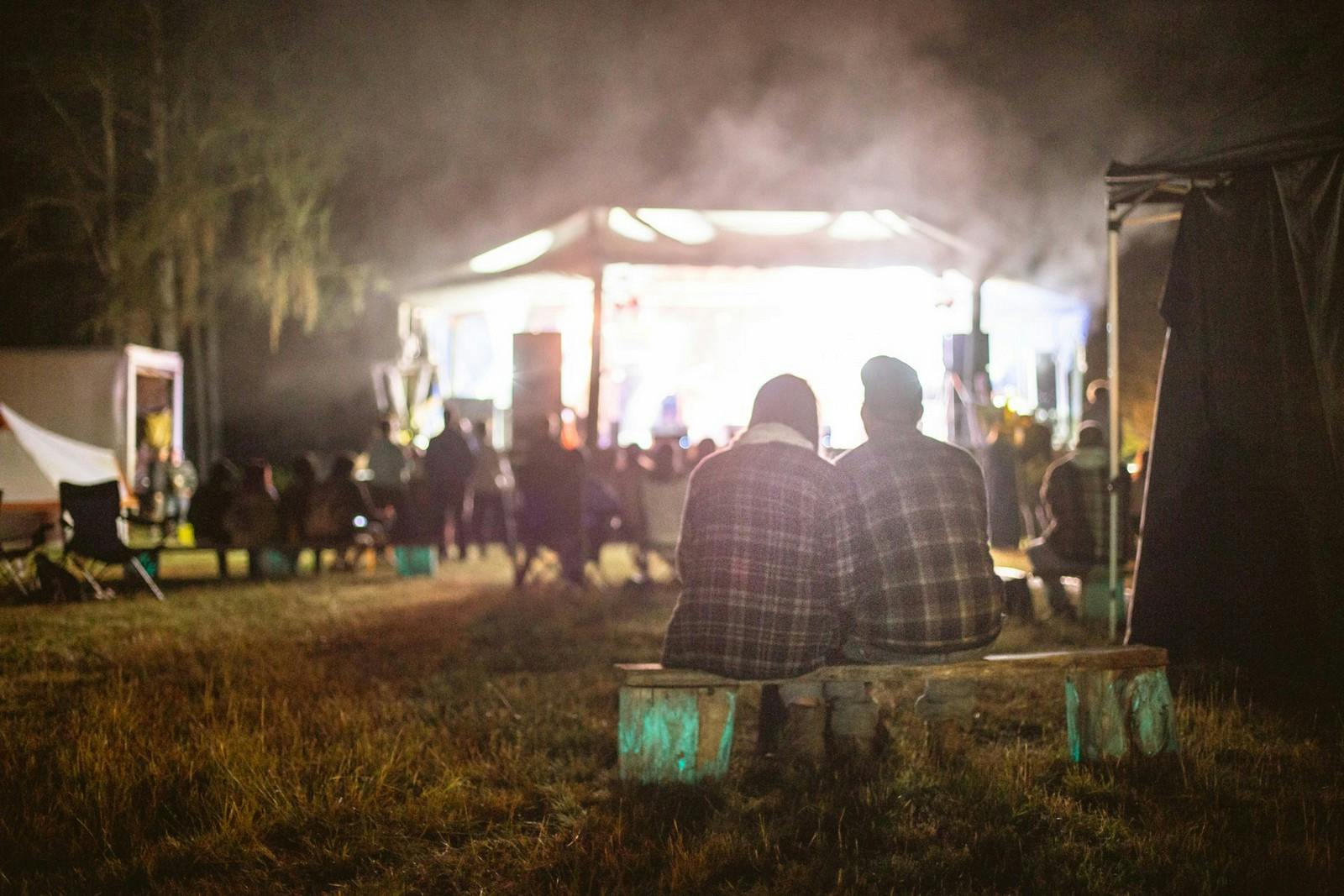 A dimly lit, night-time scene at Northern Vibe Festival, Ontario