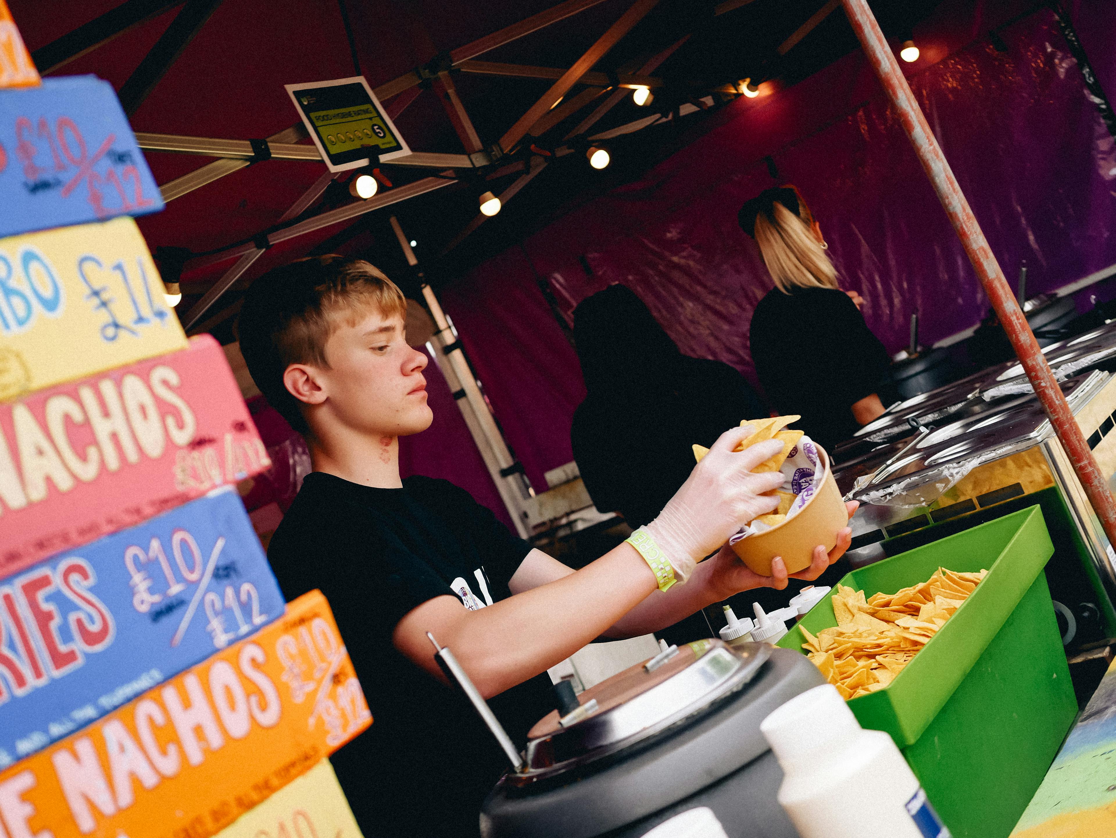 The Great Estate Festival Food Truck person serving food