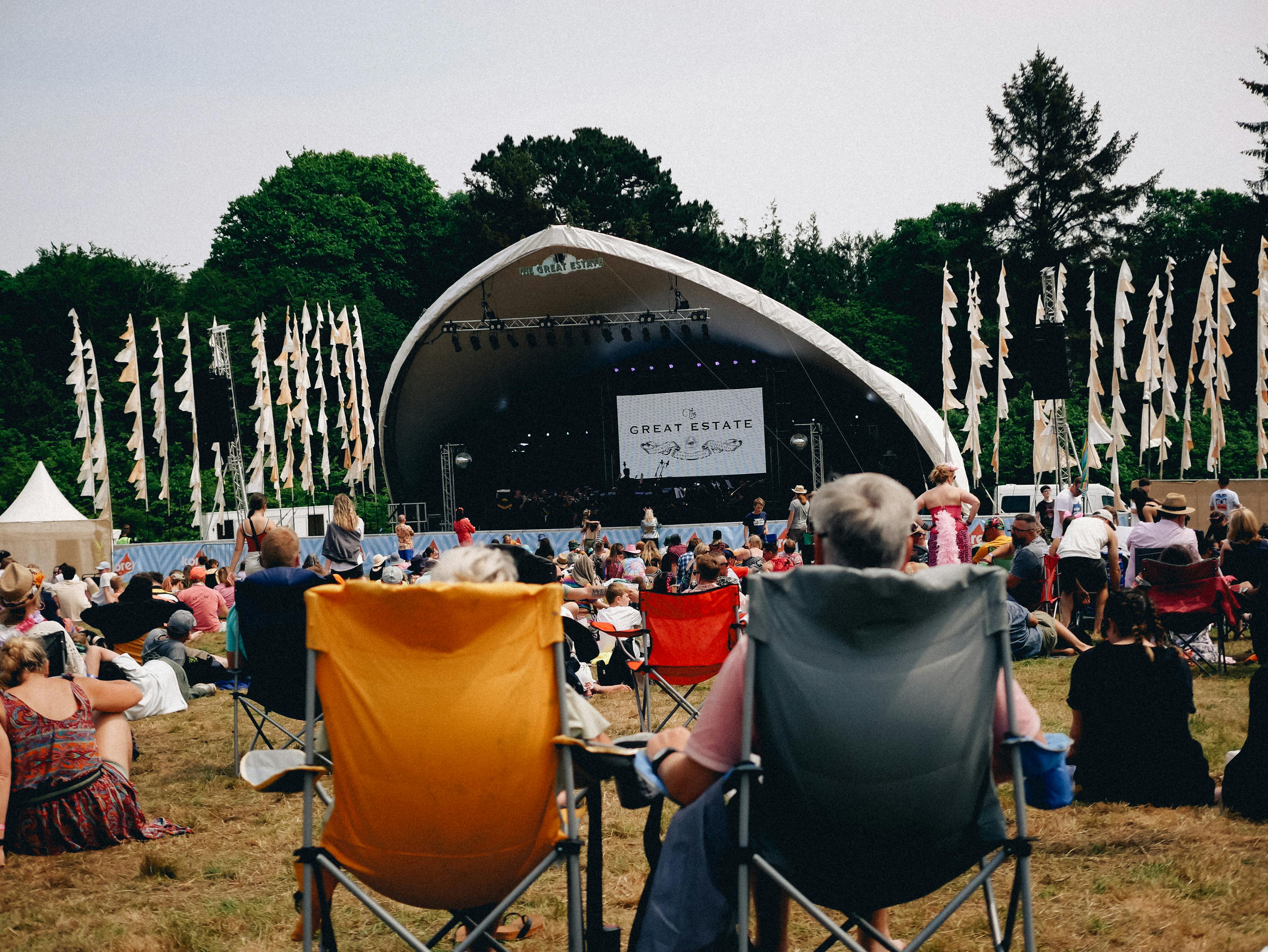 The Great Estate Festivalmusic stage with two people in camp chairs
