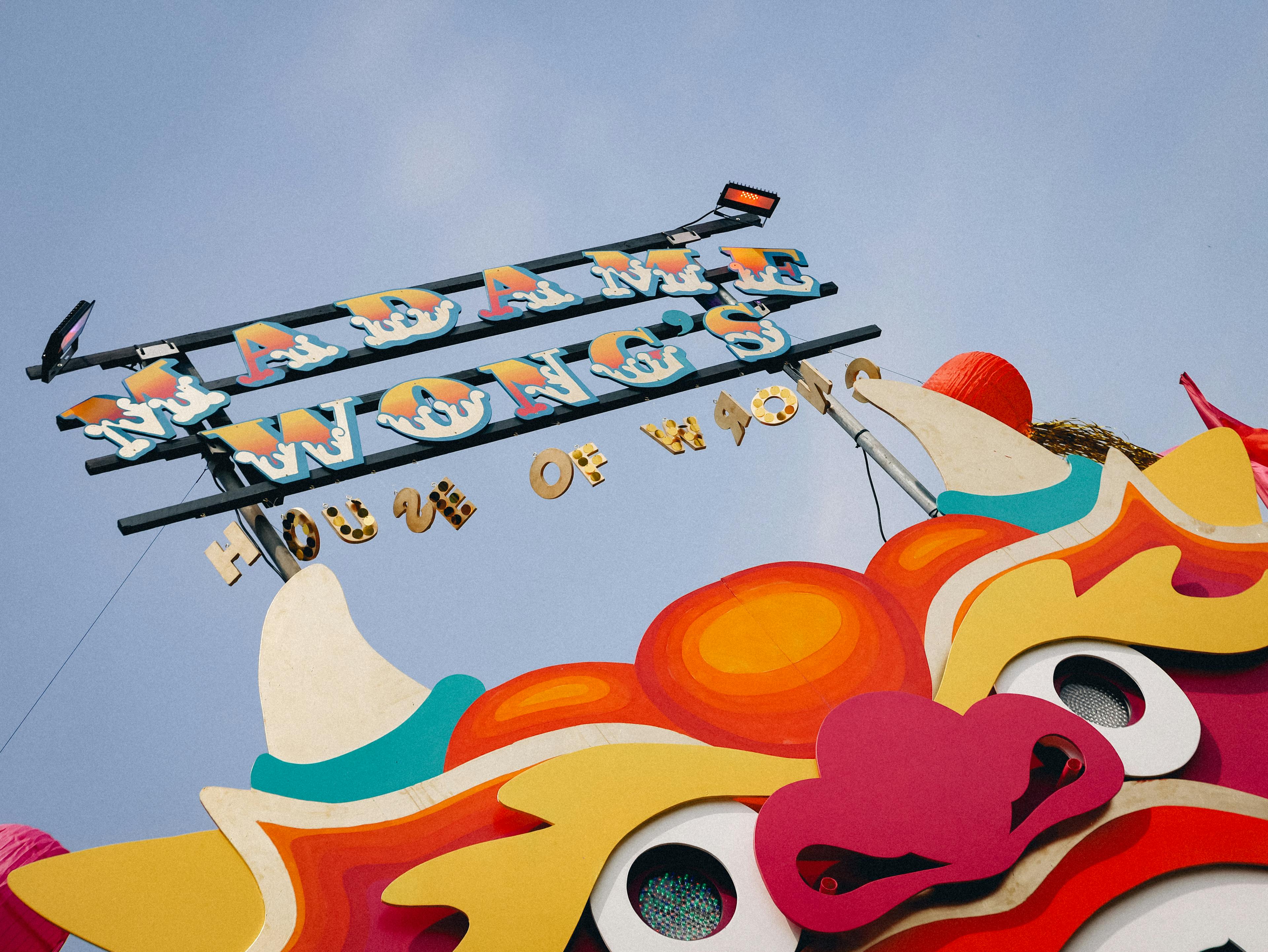 The Great Estate Festival Madame Wong sign with dragon