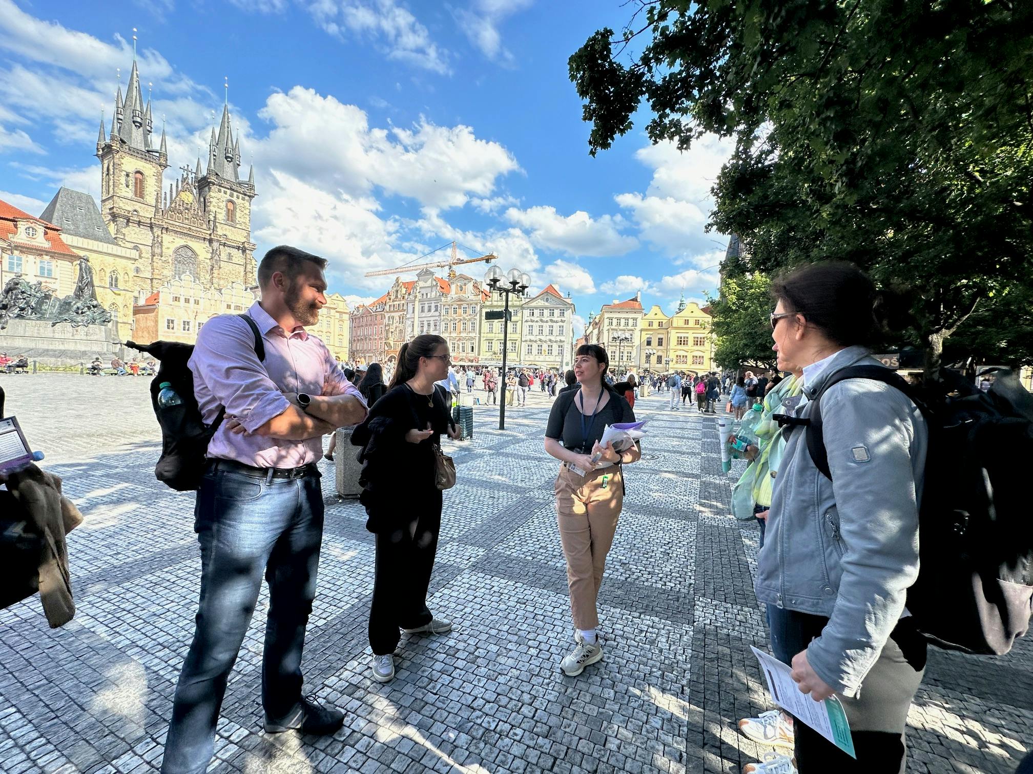 Prague Feminist Tours, tour guide Averil speaking to group of people
