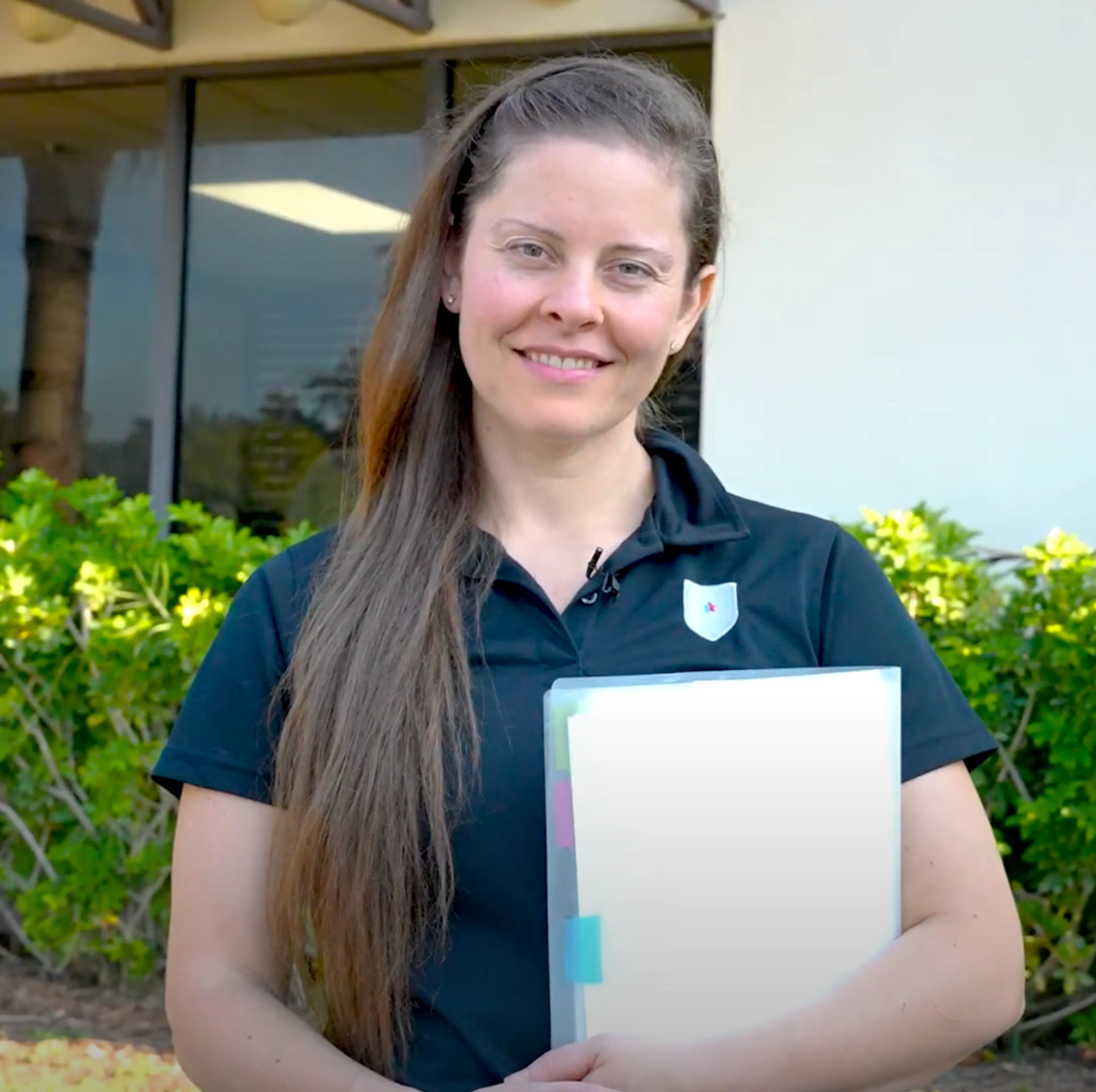 United Grid League Ruby George smiling with clipboard