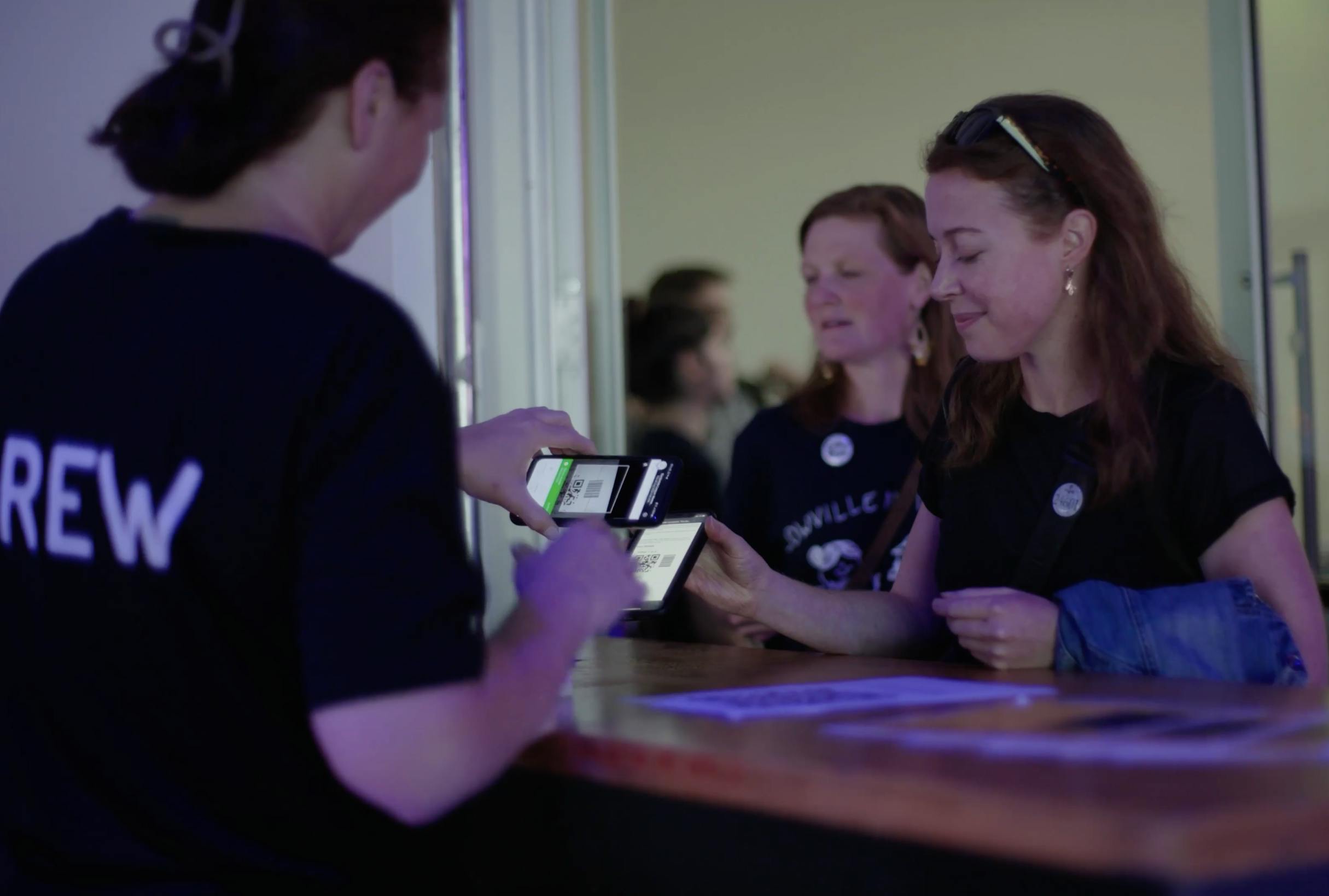 The Barista League crew scanning in ticket-holder on Ticket Tailor check-in app
