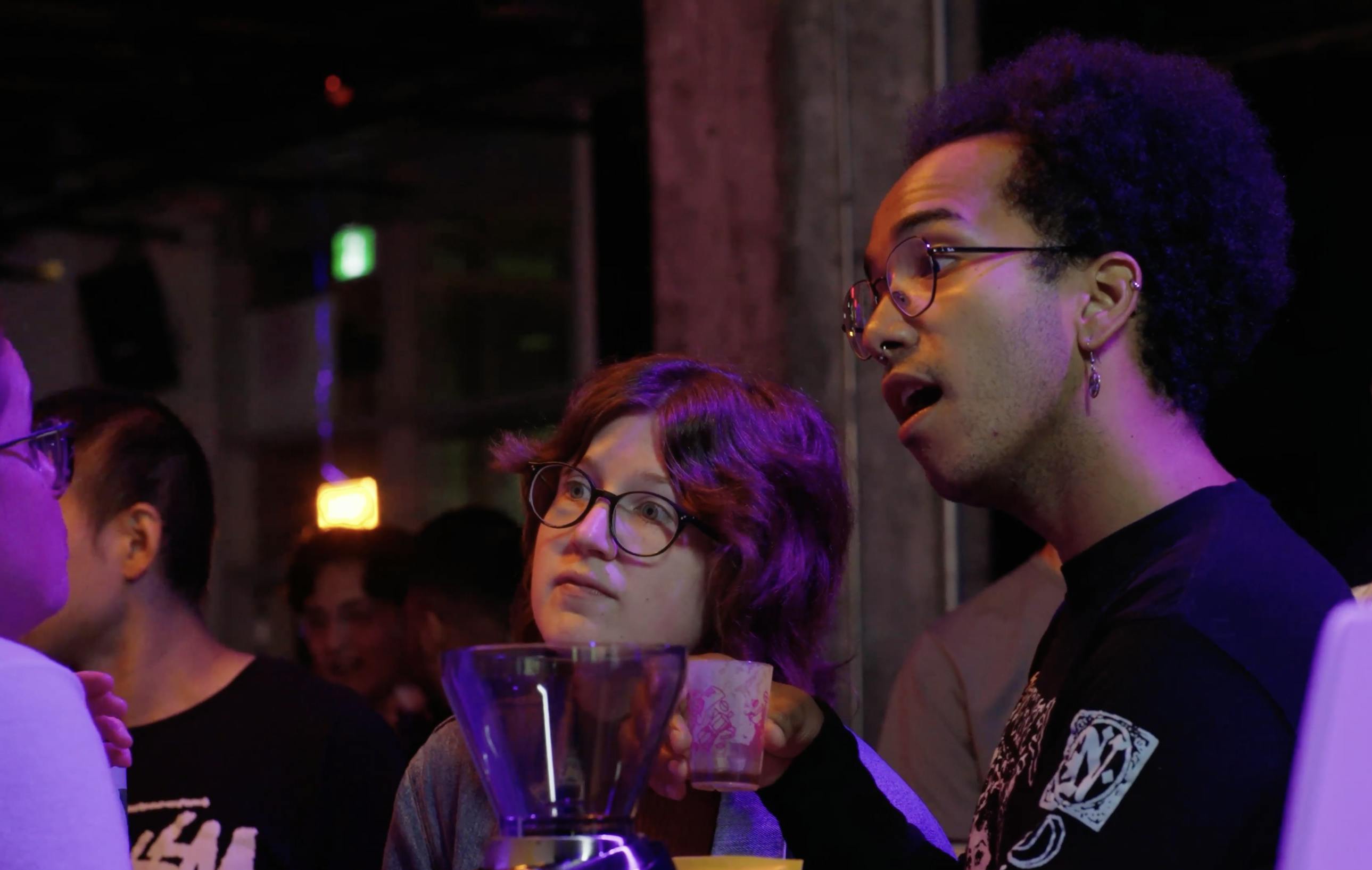 The Barista League man and women engaging in conversation