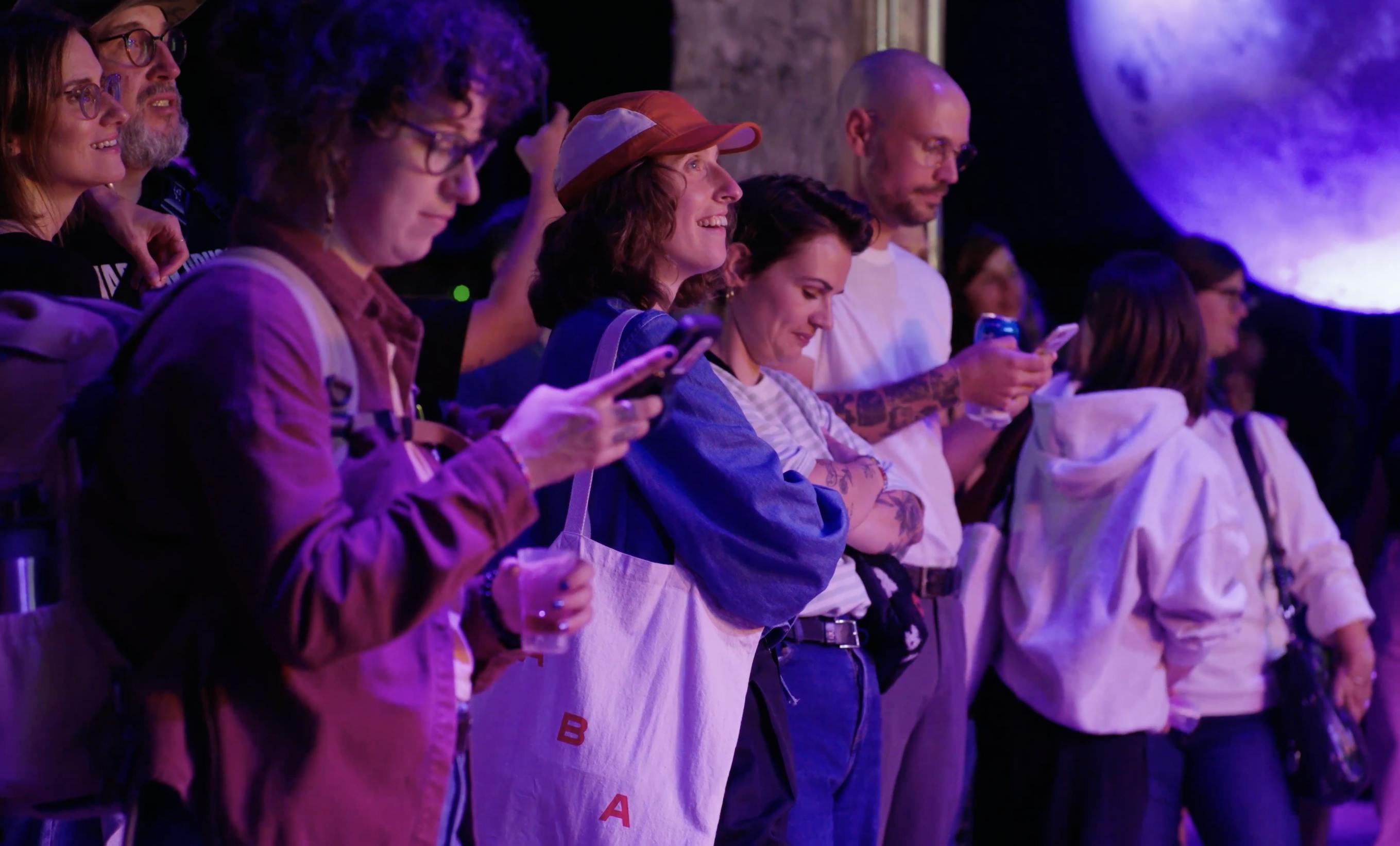 The Barista League crowd watching competition and on mobiles