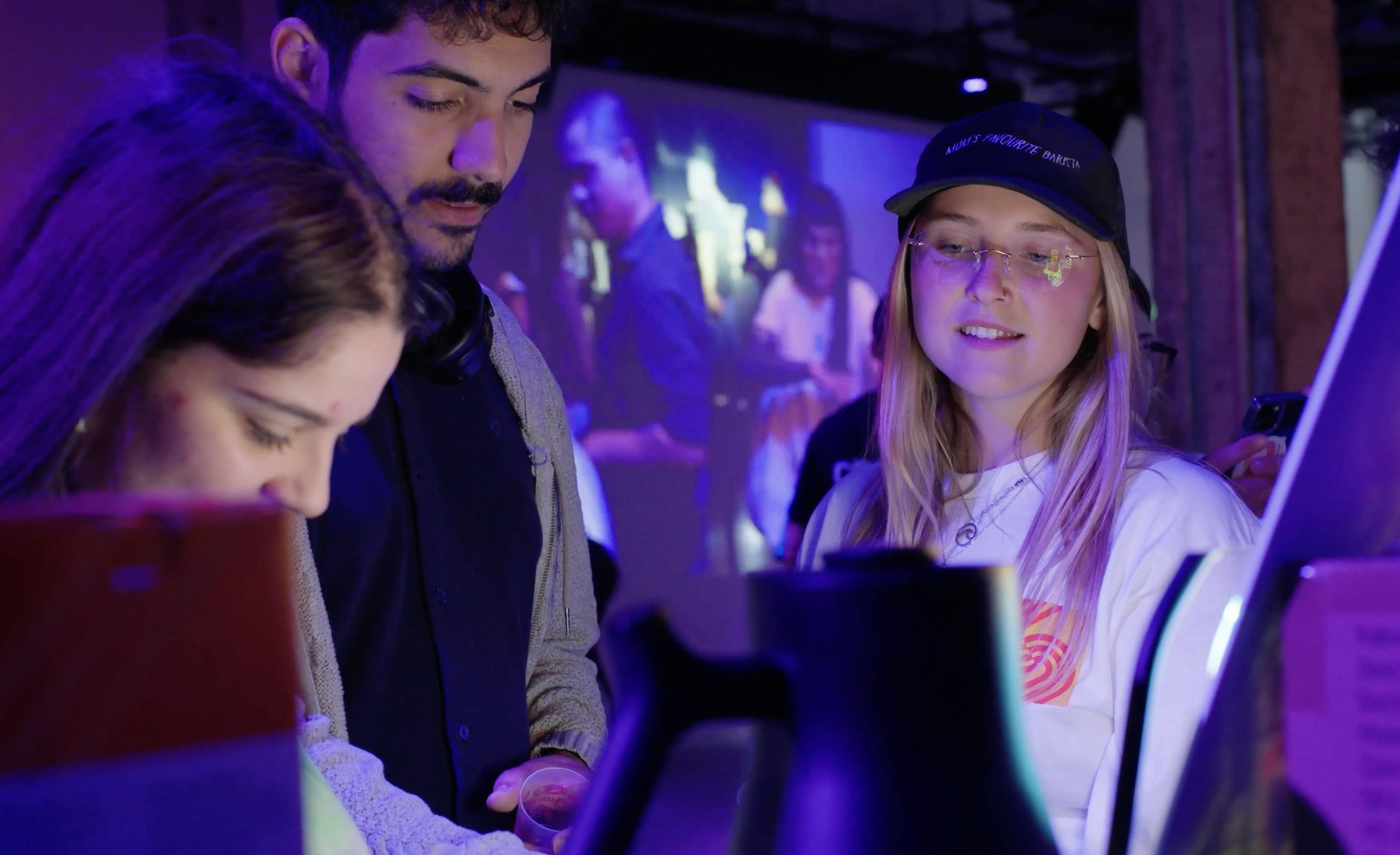 The Barista League three people in a huddle