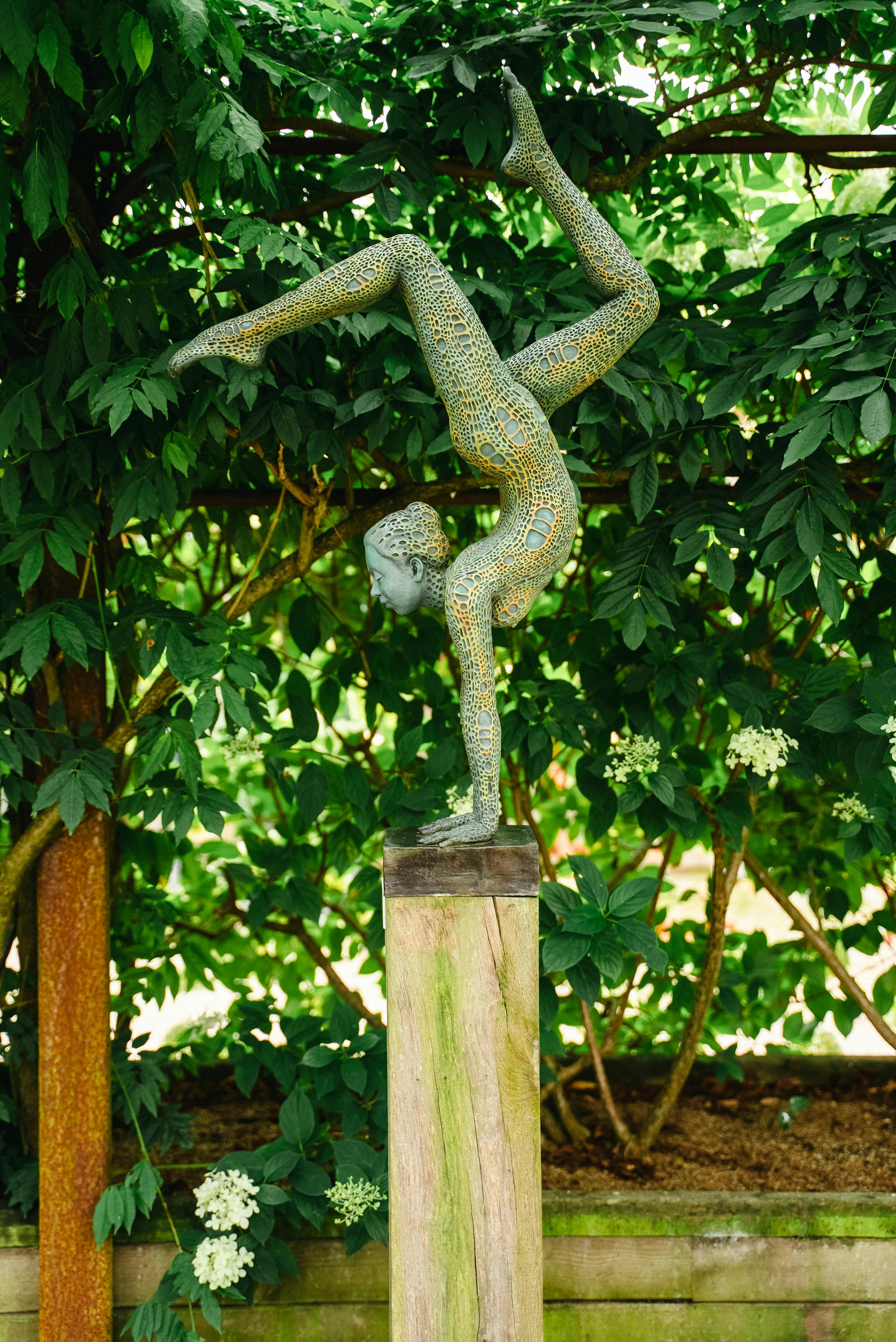 Sculpture by the Lakes sculpture of female doing handstand