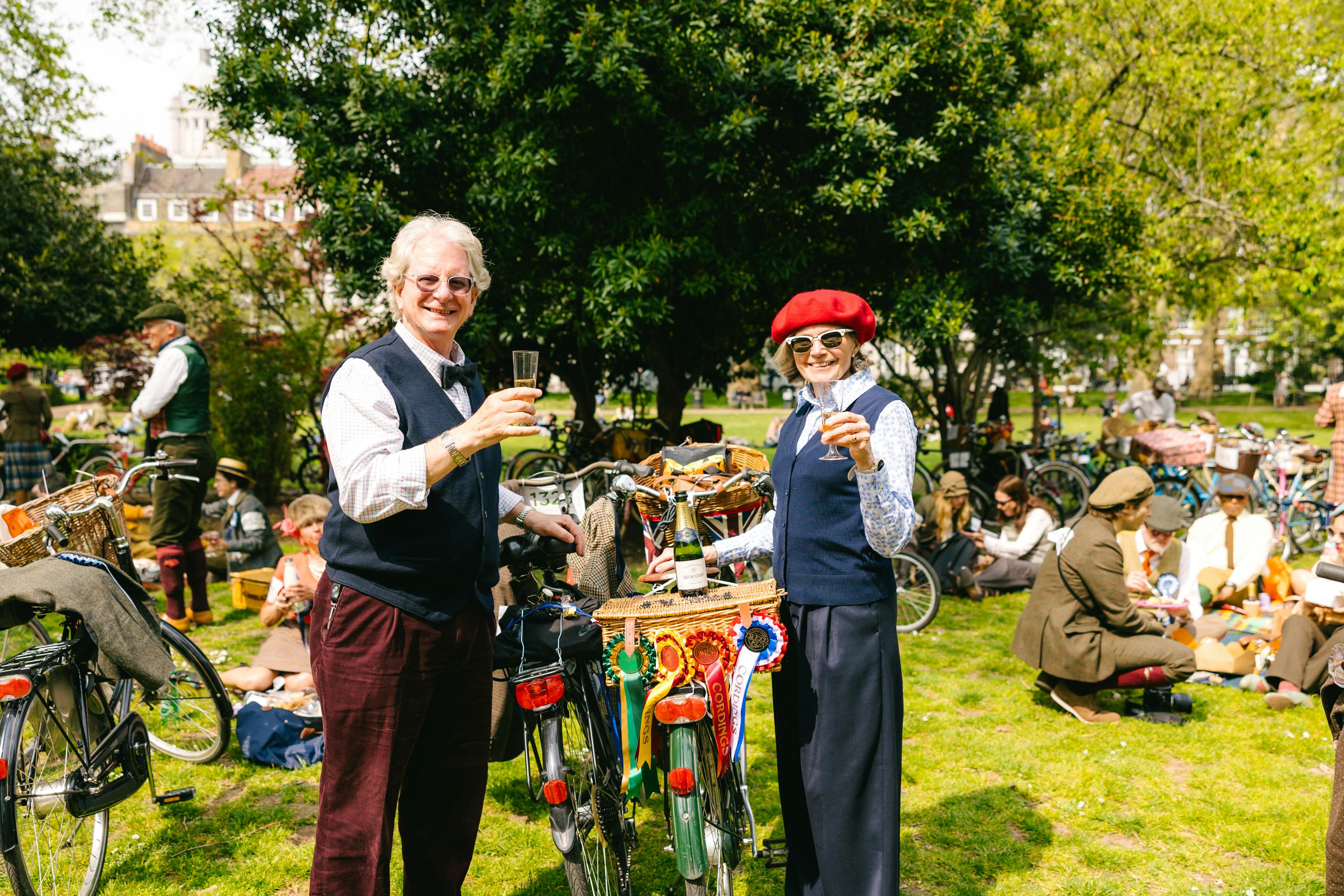 The Tweed Run older couple with champagne glasses