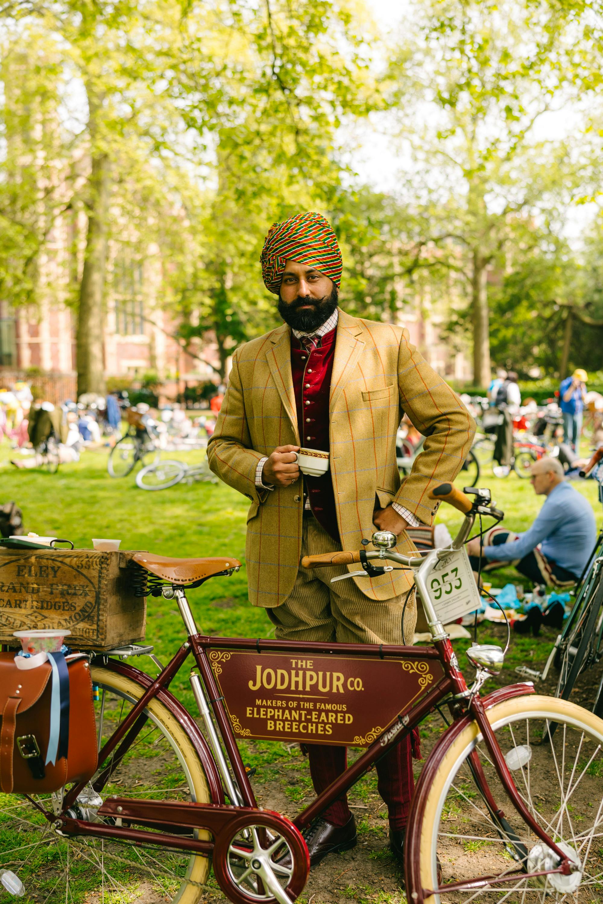 The Tweed Run Indian man in traditional tweed and turban with his bike