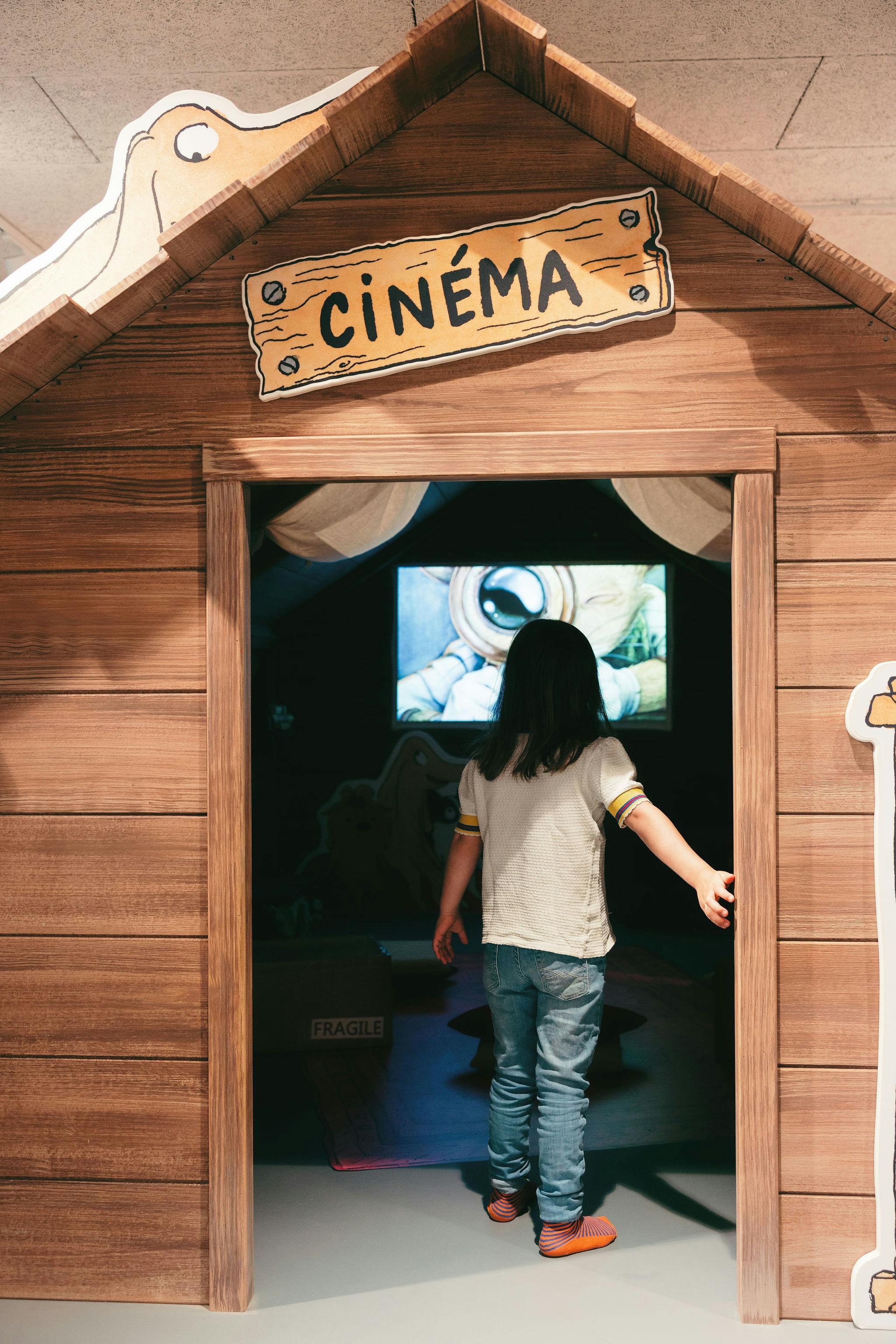 Child entering pretend cinema