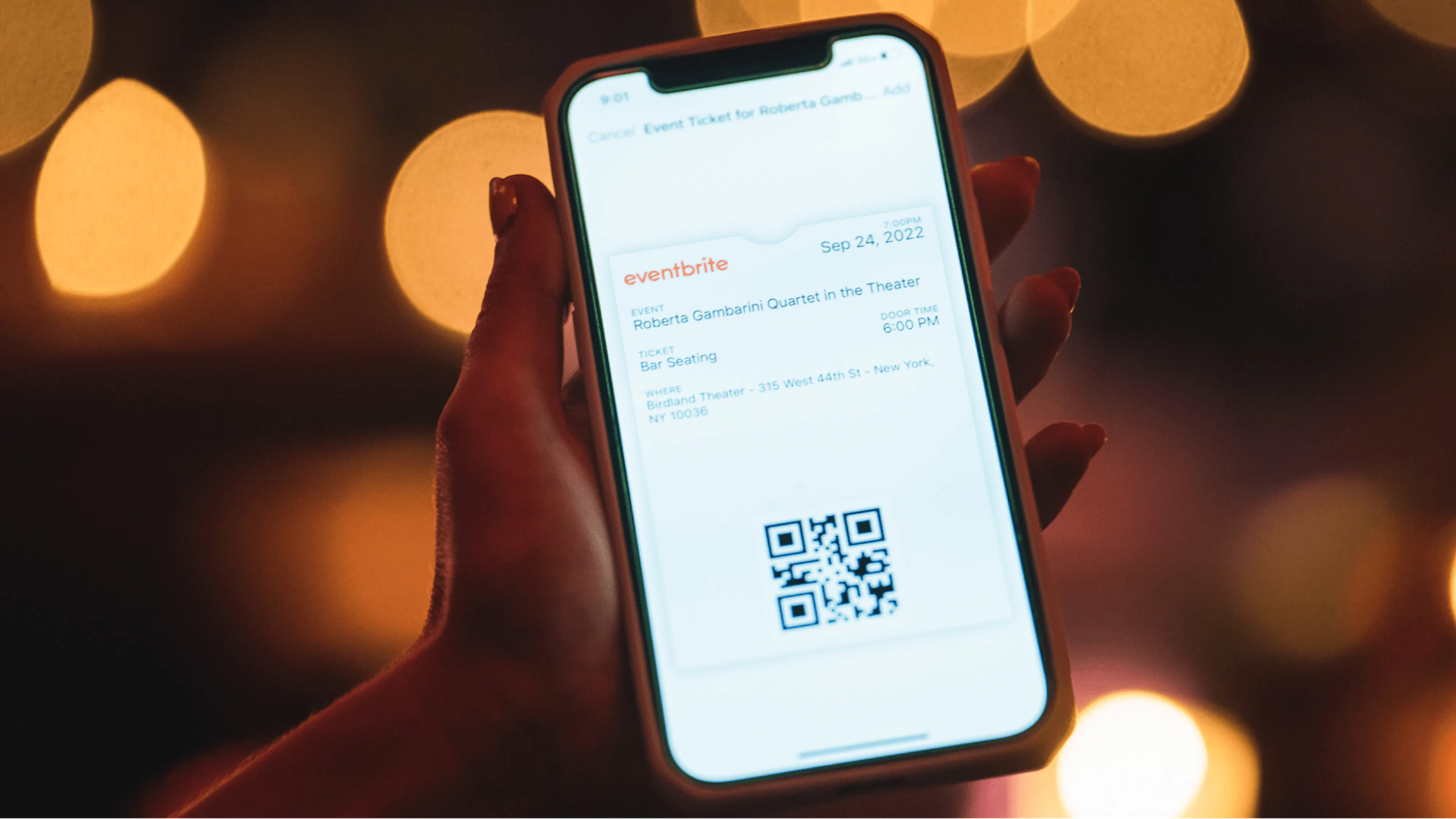 person holding eventbrite app in hand
