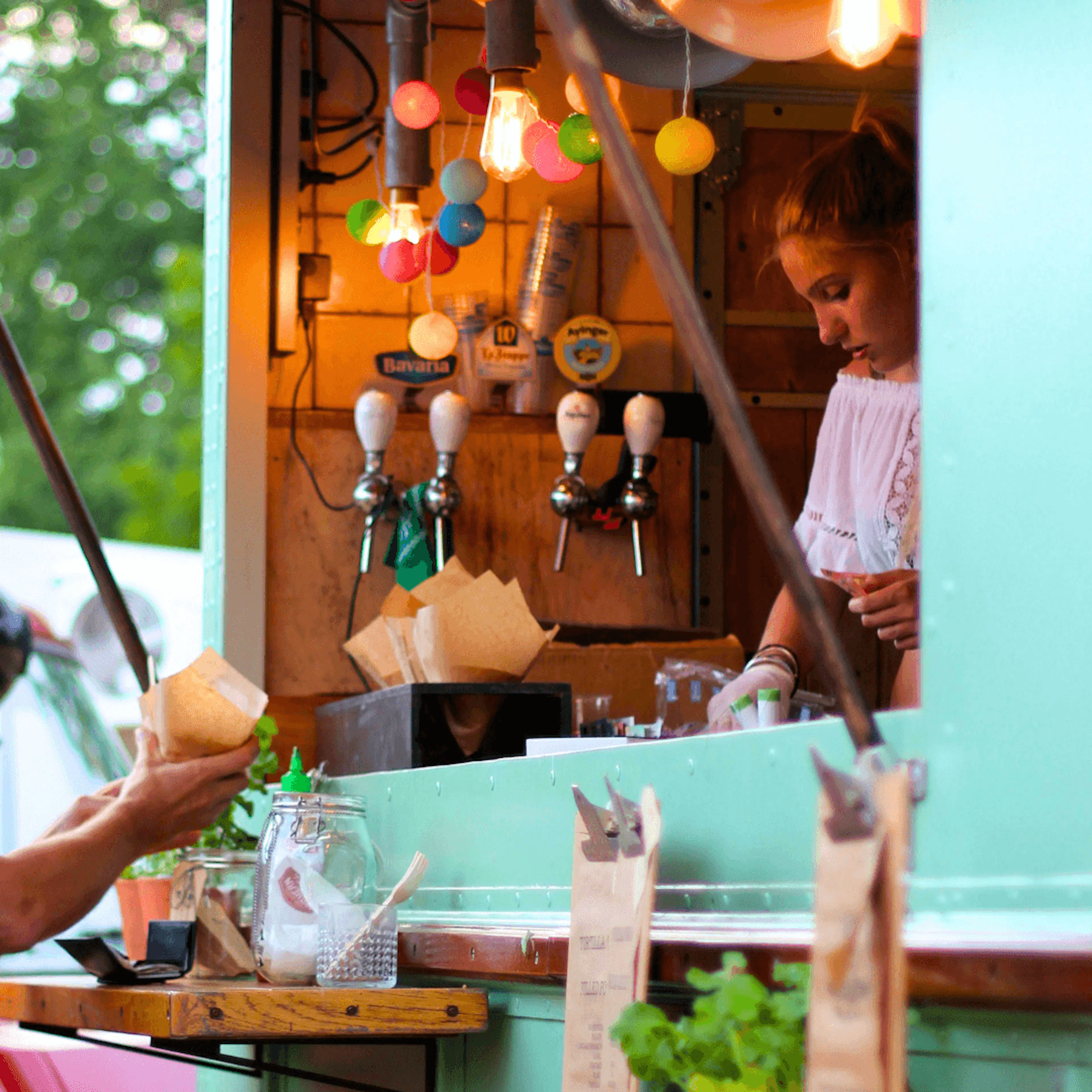 Woman serving food from food truck