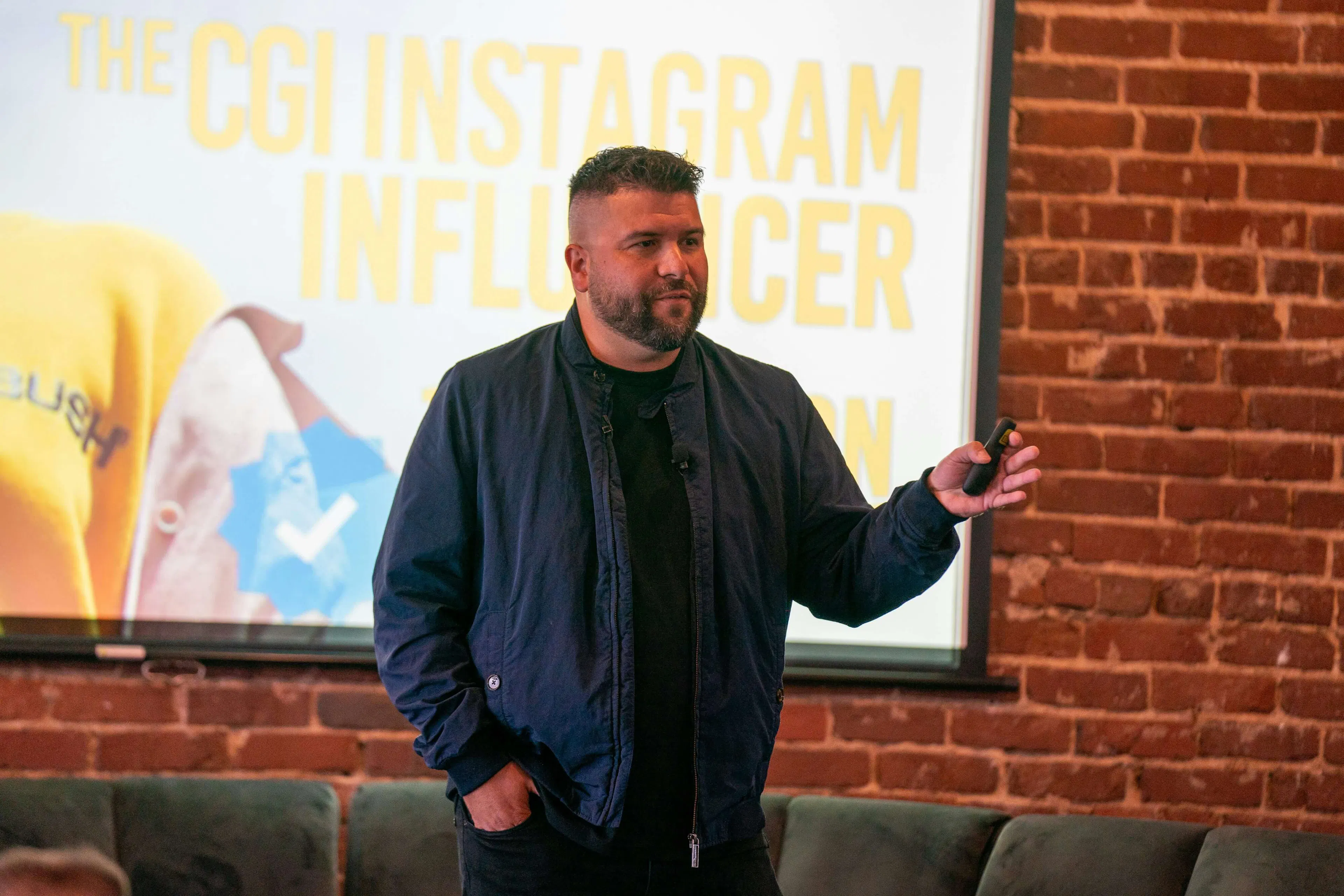 Man speaking on stage at an event
