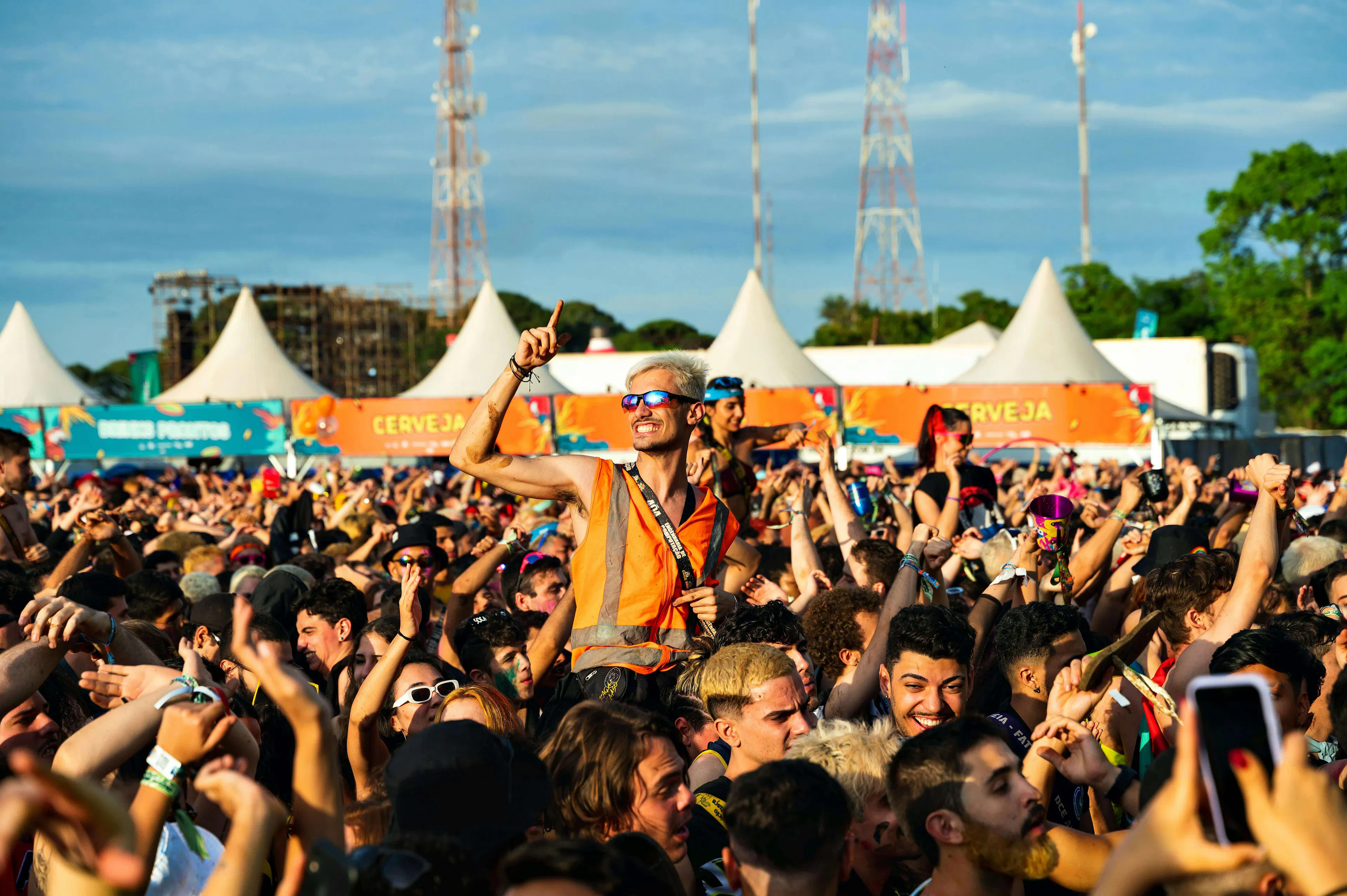 man on shoulders in festival crowd